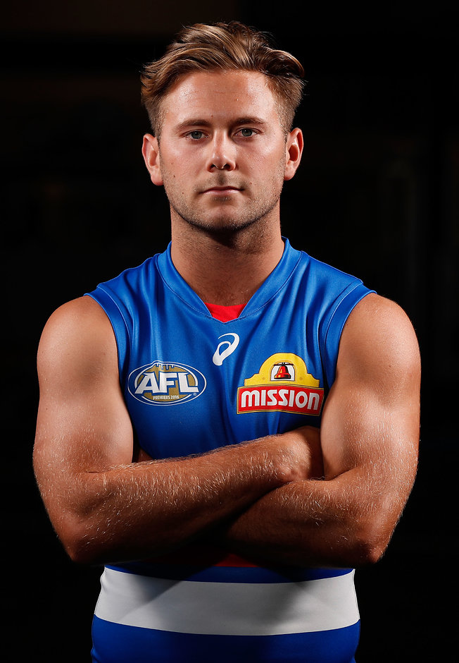 AFL 2017 Portraits - Western Bulldogs MELBOURNE, AUSTRALIA - FEBRUARY 7: Caleb Daniel of the Bulldogs poses for a portrait during the Western Bulldogs team photo day at the VU Whitten Oval on February 7, 2017 in Melbourne, Australia. (Photo by Adam Trafford/AFL Media)